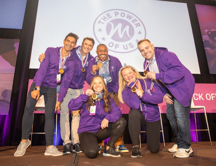 Mammotome team holding award - the power of us in the background